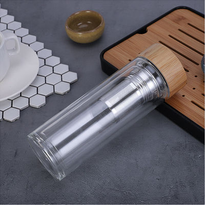 Customized Borosilicate Glass Bottle , Clear Glass Drinking Bottle With Bamboo Lid supplier